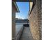 Sidewalk leading to a two-story home with brick facade and neutral siding at 621 Rockcastle Dr, Cary, NC 27519