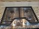 Stainless steel gas cooktop with four burners and black grates at 621 Rockcastle Dr, Cary, NC 27519