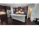 Open kitchen with granite countertops, stainless steel appliances, and a spacious center island at 621 Rockcastle Dr, Cary, NC 27519