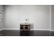 Neutral living room with hardwood floors, a console table, and crisp white trim at 621 Rockcastle Dr, Cary, NC 27519