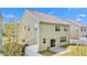 Back exterior of home featuring a sliding glass door leading to a patio, surrounded by a white fence at 69 Florence Dr, Clayton, NC 27527