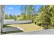 Spacious, green backyard enclosed by a white fence, perfect for outdoor activities and relaxation at 69 Florence Dr, Clayton, NC 27527