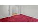 Bedroom featuring carpet floors and a doorway with glass doors leading to another part of the home at 69 Florence Dr, Clayton, NC 27527