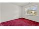 Simple bedroom with red carpeting and a view from the window, offering a cozy retreat at 69 Florence Dr, Clayton, NC 27527