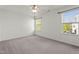 Bedroom with carpet flooring and two windows providing natural light at 69 Florence Dr, Clayton, NC 27527