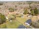 Aerial view of the neighborhood showcasing the treeline and large home lots at 711 Wheat Mill Rd, Durham, NC 27704