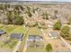 Aerial view of the homes and neighborhood with mature trees and well manicured lawns at 711 Wheat Mill Rd, Durham, NC 27704