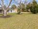 Lush green backyard featuring mature trees and a well-maintained lawn at 711 Wheat Mill Rd, Durham, NC 27704