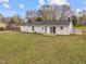Spacious backyard with new siding and paint at 711 Wheat Mill Rd, Durham, NC 27704