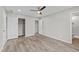Bright bedroom featuring hard surface floors, ceiling fan, and closet for ample storage at 711 Wheat Mill Rd, Durham, NC 27704