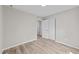 This cozy bedroom features neutral walls, light wood flooring, and a closet at 711 Wheat Mill Rd, Durham, NC 27704