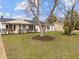 A charming home with a well-kept lawn and shade trees at 711 Wheat Mill Rd, Durham, NC 27704
