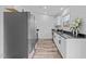 Modern kitchen features a stainless steel refrigerator and stainless steel appliances at 711 Wheat Mill Rd, Durham, NC 27704