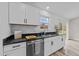 Charming kitchen features stainless steel appliances, subway tile backsplash, and granite countertops at 711 Wheat Mill Rd, Durham, NC 27704
