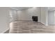 Spacious living room with fireplace, featuring recessed lighting and wood-look floors at 711 Wheat Mill Rd, Durham, NC 27704
