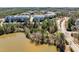 Scenic view of a condominium complex near a lake with wooded areas and winding roads at 714 Waterford Lake Dr, Cary, NC 27519