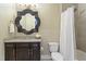 Bathroom with granite vanity, designer mirror, and shower with curtain at 714 Waterford Lake Dr, Cary, NC 27519