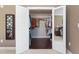 Walk-in closet with wood floors and closet organizer, full of hanging clothes and shelving at 714 Waterford Lake Dr, Cary, NC 27519