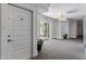 Hallway with carpet, access to unit 714, and decorative plants at 714 Waterford Lake Dr, Cary, NC 27519