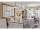Stylish kitchen island with granite countertops, pendant lighting, seating and dining area at 714 Waterford Lake Dr, Cary, NC 27519