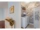 Laundry area with washer and dryer, and custom wallpaper at 714 Waterford Lake Dr, Cary, NC 27519