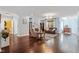 Spacious living room featuring hardwood floors, comfortable seating, fireplace and decorative rug at 714 Waterford Lake Dr, Cary, NC 27519