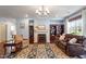Elegant living room with hardwood floors, fireplace, comfortable seating, and decorative rug at 714 Waterford Lake Dr, Cary, NC 27519