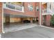 Covered parking area of a brick apartment building, offering convenient resident parking at 714 Waterford Lake Dr, Cary, NC 27519