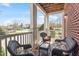 Covered porch with wicker furniture and view of yard at 714 Waterford Lake Dr, Cary, NC 27519