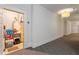 Hallway with a storage area, featuring shelving for organization and storage at 714 Waterford Lake Dr, Cary, NC 27519