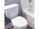 A well-lit toilet with a white bathtub in the background, modern and hygienic design at 8 Elaine Cir, Durham, NC 27703