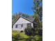 Well-maintained home with a charming exterior, featuring lush landscaping and a tranquil setting on a sunny day at 8 Elaine Cir, Durham, NC 27703
