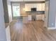 Bright kitchen features white cabinets, modern appliances, and convenient breakfast bar at 8 Elaine Cir, Durham, NC 27703
