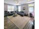Inviting living room featuring neutral colors, plush seating, large windows, and stylish rug, perfect for relaxation at 8 Elaine Cir, Durham, NC 27703