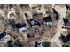 Aerial view of the property, nestled in a neighborhood setting, showcases the home's roof and surrounding landscape at 8116 Windsor Ridge Dr, Raleigh, NC 27615