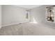 Neutral bedroom featuring two windows and carpet flooring at 8116 Windsor Ridge Dr, Raleigh, NC 27615