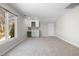 Bright bonus room with neutral carpet, wet bar with wine rack, and large window bringing in lots of natural light at 8116 Windsor Ridge Dr, Raleigh, NC 27615