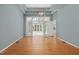 This bright dining room features hardwood floors, coffered ceilings, and French doors leading to the living room at 8116 Windsor Ridge Dr, Raleigh, NC 27615