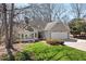 Charming home with stone accents, bright lawn, and an attached two car garage at 8116 Windsor Ridge Dr, Raleigh, NC 27615