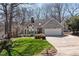 Charming home with stone accents, bright lawn, and an attached two car garage at 8116 Windsor Ridge Dr, Raleigh, NC 27615