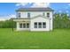 Spacious backyard featuring a covered patio and ample green space, perfect for outdoor activities at 8729 Maxine St # 38, Willow Springs, NC 27592