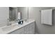 Bathroom featuring double sinks, a large mirror, and contemporary fixtures at 8729 Maxine St # 38, Willow Springs, NC 27592