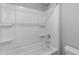 Pristine bathroom featuring a white tub with shower, offering a clean and functional space at 8729 Maxine St # 38, Willow Springs, NC 27592