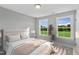 Sunlit bedroom with tranquil backyard view, offering relaxation and peace at 8729 Maxine St # 38, Willow Springs, NC 27592