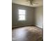 This bedroom features wood-look flooring, a ceiling fan, and a window with a view at 912 Pamela Ln, Rocky Mount, NC 27803