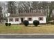 Charming single-story home featuring white siding, red shutters, and a well-maintained front lawn at 912 Pamela Ln, Rocky Mount, NC 27803
