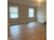 Large living room with warm vinyl flooring and natural light at 912 Pamela Ln, Rocky Mount, NC 27803