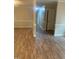 Open-concept living space with beautiful flooring, neutral walls, and ample natural light at 912 Pamela Ln, Rocky Mount, NC 27803