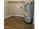 This utility room features wood-look flooring and a large AO Smith 100 water heater at 912 Pamela Ln, Rocky Mount, NC 27803