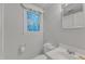 Bright bathroom featuring a white vanity and decorative stained glass window at 913 Ranch Farm Rd, Raleigh, NC 27603